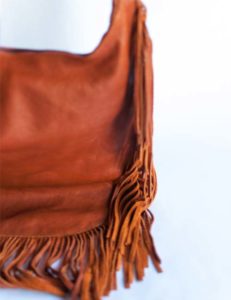 carin-genuine-leather-sling-bag-with-tassels-brown